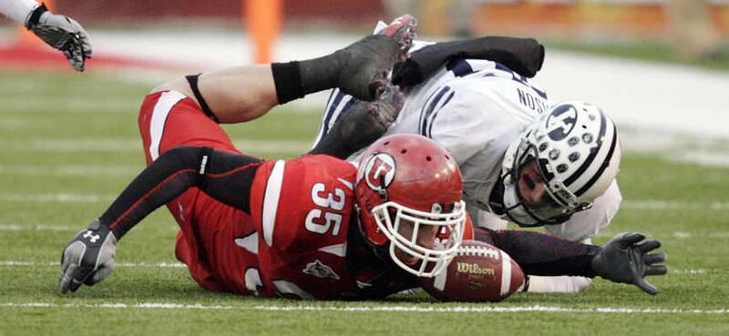 Utah Utes cornerback Greg Bird (35) recovers the muffed punt form Brigham Young Cougars tight end Bryan Sampson (85) in college football action in Salt Lake City, Utah, Saturday, Nov. 27, 2010. (Jeffrey D. Allred, Deseret News)