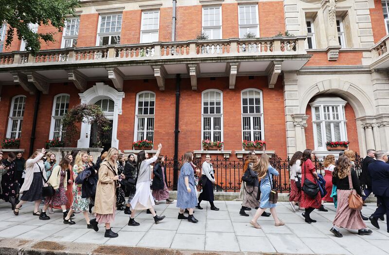 Missionaries walk to a London and Birmingham combined missions meeting in London, England on Friday Oct. 29, 2021.