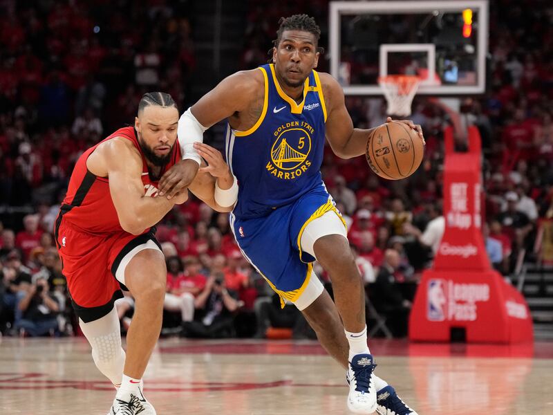 Houston Rockets guard Fred VanVleet, left, tries to defend against Golden State Warriors forward Kevon Looney (5) during first-round playoff series in Houston, Wednesday, April 23, 2025. The Rockets beat the Golden State Warriors 109-92.
