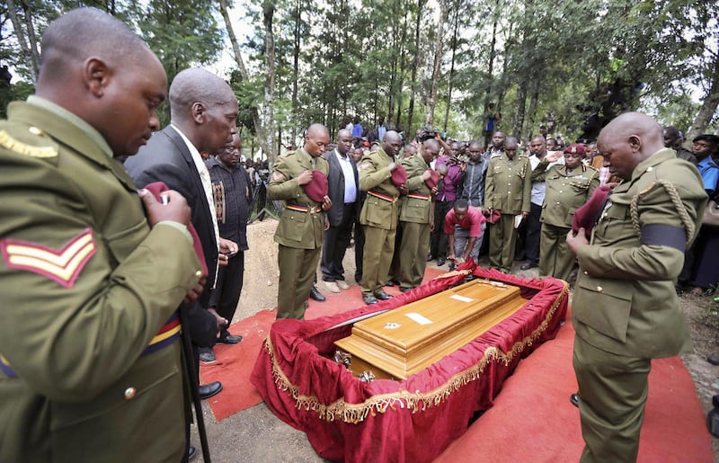 Members of the Kenya Police department's elite Recce Company and relatives pay their respects at the funeral of Corporal Benard Kipkemoi Tonui, who died in last week's attack on Garissa University College by al-Shabab militants, in the village of Cheleget