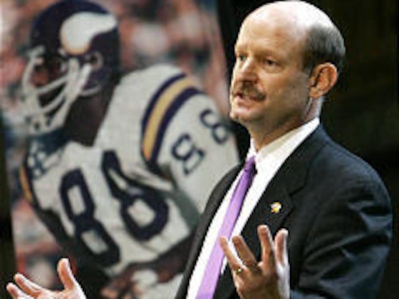 Newly named Minnesota Vikings football head coach Brad Childress, a former Utah assistant, answers questions at a news conference Friday.