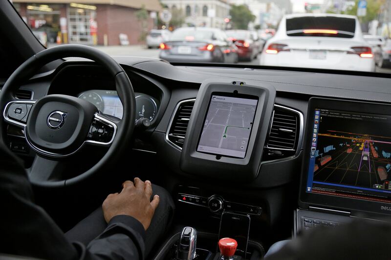 An Uber driverless car waits in traffic during a test drive in San Francisco.
