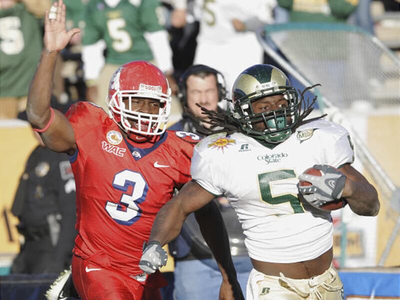 Colorado State's Gartrell Johnson (5) runs for a touchdown in front of Fresno State's Moses Harris (3) during the fourth quarter of the New Mexico Bowl. He rushed for a career-best 285 yards in the Rams' 40-35 win.