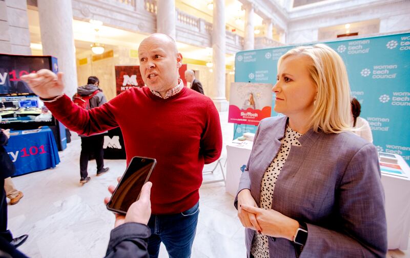 Jeff Burningham, founder and chairman of Peak Capital Partners, and Cydni Tetro, CEO of ForgeDX and co-founder and president of Women Tech Council, talk during Tech Day on the Hill at the state Capitol in Salt Lake City on Monday, Feb. 25, 2019.