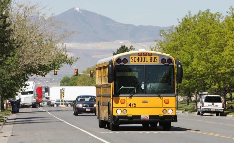 A Canyons School District bus drives near Altara Elementary in Sandy Tuesday, May 13, 2014. Police in Draper are now investigating whether a former school bus driver under investigation in Sandy for allegations of child sex abuse on the bus may have als