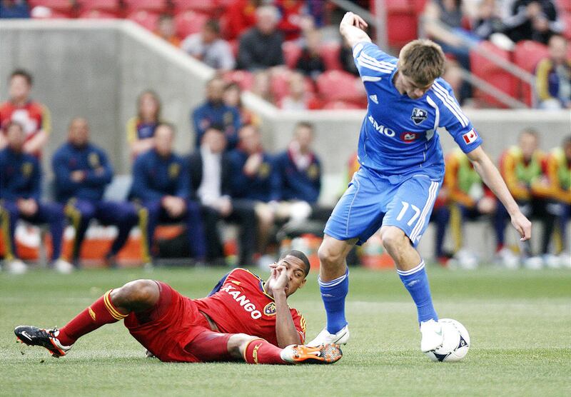 Chris Schuler of Real Salt Lake fights for control of the ball against Justing Braun of the Montreal Impact during their MLS match up at Rio Tinto Stadium in Sandy Wednesday, April 4, 2012.