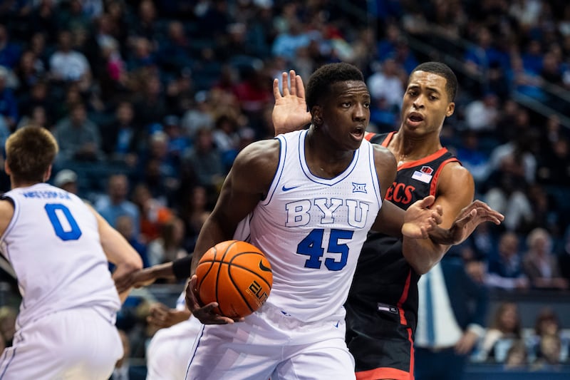 BYU forward Fousseyni Traore grabs a rebound away from San Diego State forward Jaedon LeDee, right, during a game in Provo.