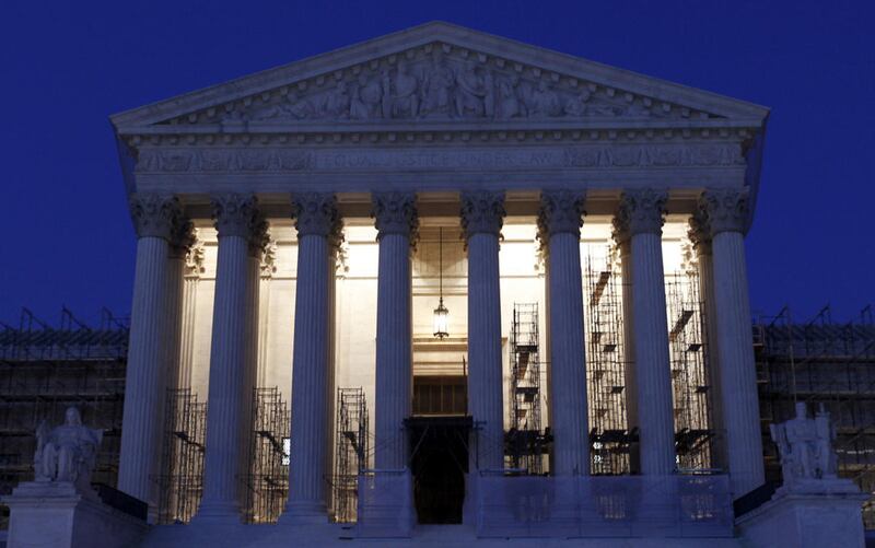 Which states have trigger laws in place designed to ban access to abortion if Roe v. Wade is overturned?