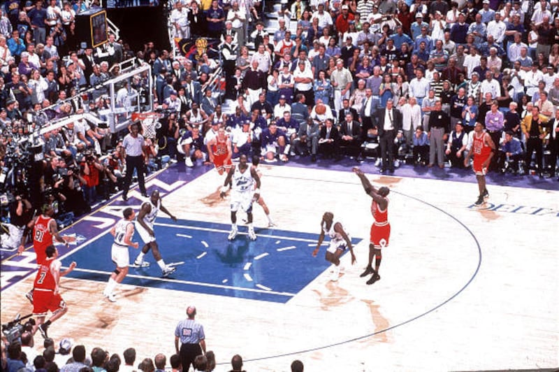 The Chicago Bulls' Michael Jordan makes the game-winning shot, on a play Jazz fans still question whether or not it was a push-off, during Game 6 of the NBA Finals against Utah at the Delta Center.