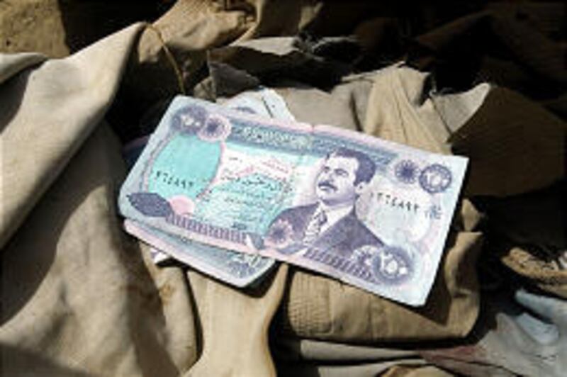 Money taken from an Iraqi enemy prisoner of war shows a portrait of Saddam Hussein. The United States believes it has found at least $300 million Saddam hid in banks, but it's having trouble getting countries to hand it over.