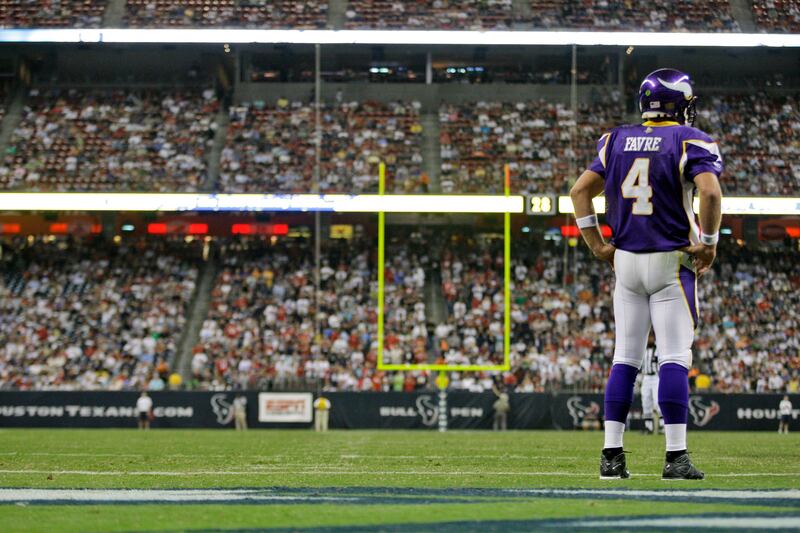 Minnesota Vikings quarterback Brett Favre (4) stands on the field during a preseason game against the Houston Texans in 2009.