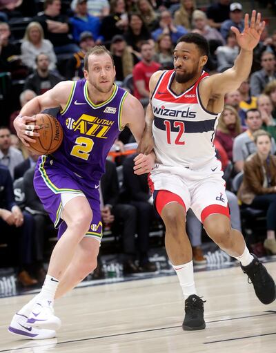 Utah Jazz forward Joe Ingles (2) moves around Washington Wizards forward Jabari Parker (12) during an NBA basketball game at the Vivint Smart Home Arena in Salt Lake City on Friday, March 29, 2019.