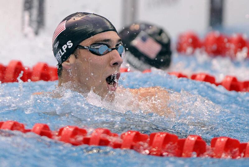 The Aug. 16, 2012 file photo shows United States' Michael Phelps reacting after winning the gold medal in the men's 100-meter butterfly final during the swimming competitions in the National Aquatics Center at the Beijing 2008 Olympics in Beijing.