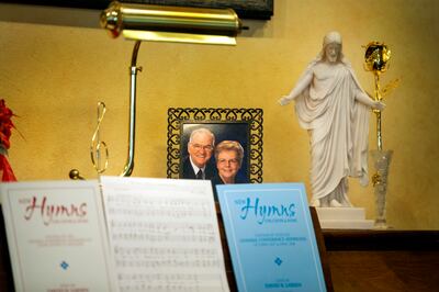 A photo of Doug and Janice Kapp Perry sits on a piano alongside a Christus statue in Janice's office at her home in Provo on Monday, Oct. 1, 2018.