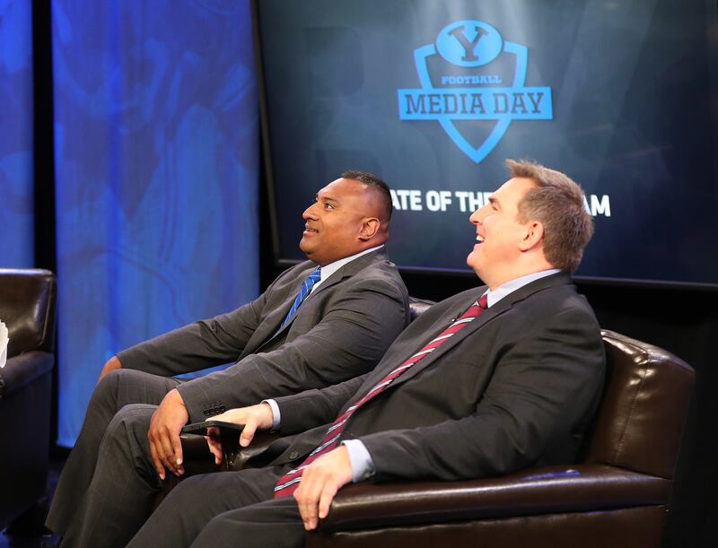 BYU head coach Kalani Sitake and former Cougar Trevor Matich wait to be interviewed during football media day in Provo on Tuesday, June 18, 2019.