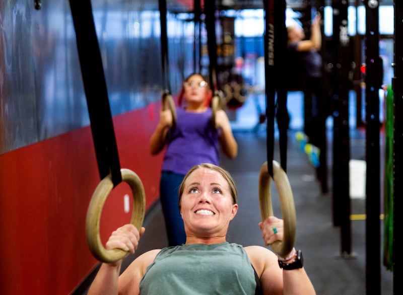 Jody Reid participates in a fitness class at Roy CrossFit in Roy on Wednesday, Nov. 9, 2022.
