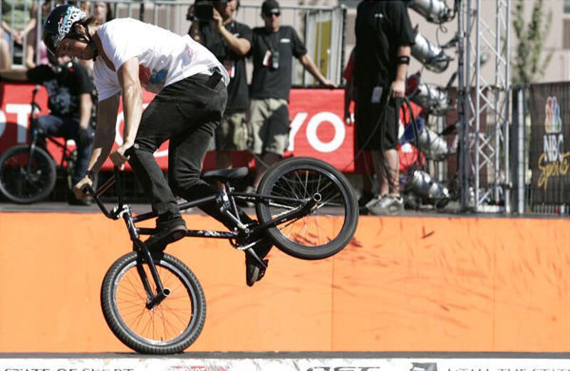 A BMX biker competes in the final round of the BMX Park challenge on the last day of the Dew Tour at the EnergySolutions Arena in Salt Lake City on Sunday.