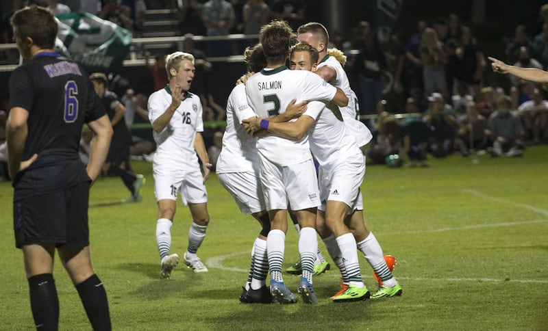 The 24th-ranked UVU men's soccer team celebrates the game-winning goal in its 2-1 win over No. 20 Washington on Friday night in Orem.