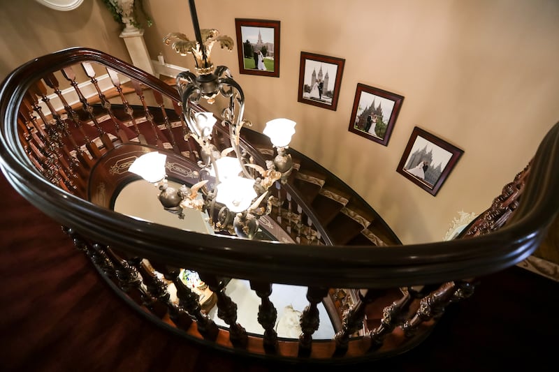 A staircase inside the historic Walker family estate on Walker Lane in Holladay is pictured on Thursday, Aug. 9, 2018. The home was originally built in 1895 by the Walker family and has been occupied by Jeff and Nancy Flamm and their family since 1997.