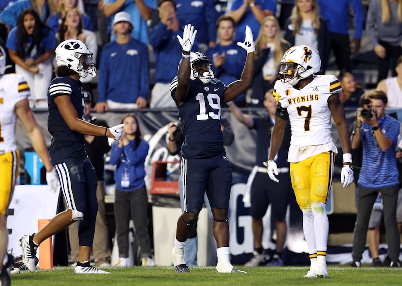 BYU running back Miles Davis celebrates a long run against Wyoming at LaVell Edwards Stadium in Provo, Sept. 24, 2022.