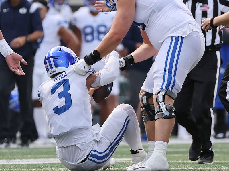 Brigham Young Cougars quarterback Jaren Hall (3) is helped up after being knocked down at Autzen Stadium on Sept. 17, 2022.