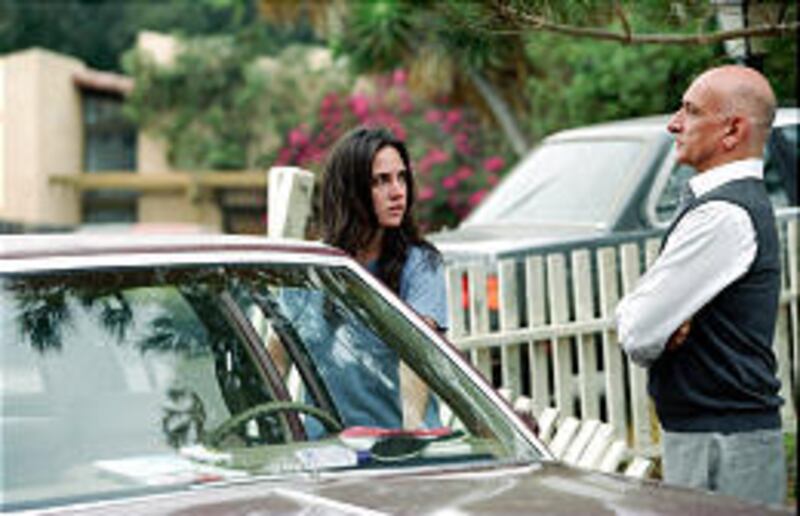 Kathy Niccolo (Jennifer Connelly) and Massoud Amir Behrani (Ben Kingsley) battle over the ownership of a house in "House of Sand and Fog."