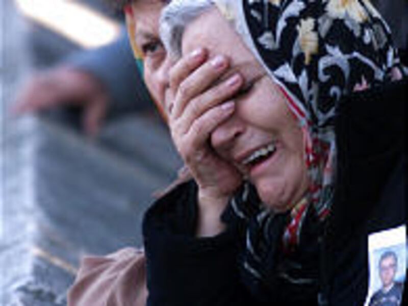 Zinet Caglayan mourns during the funeral of her nephew, Adem Tezel, in an Istanbul mosque Saturday. Tezel died in a terrorist blast Thursday.