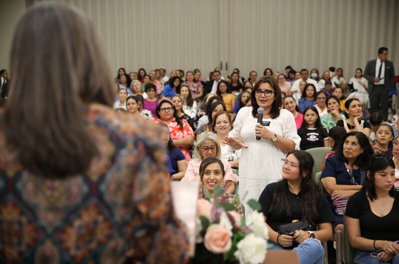 Sister Andrea Muñoz Spannaus of the Young Women General Presidency listens to a question from a participant during a devotional in Guadalajara, Mexico.