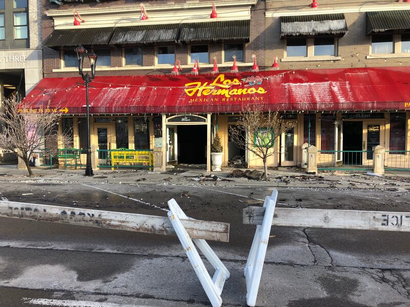 FILE - Firefighters put out hot spots at the Los Hermanos Mexican restaurant in Provo on Tuesday, Feb. 12, 2019.