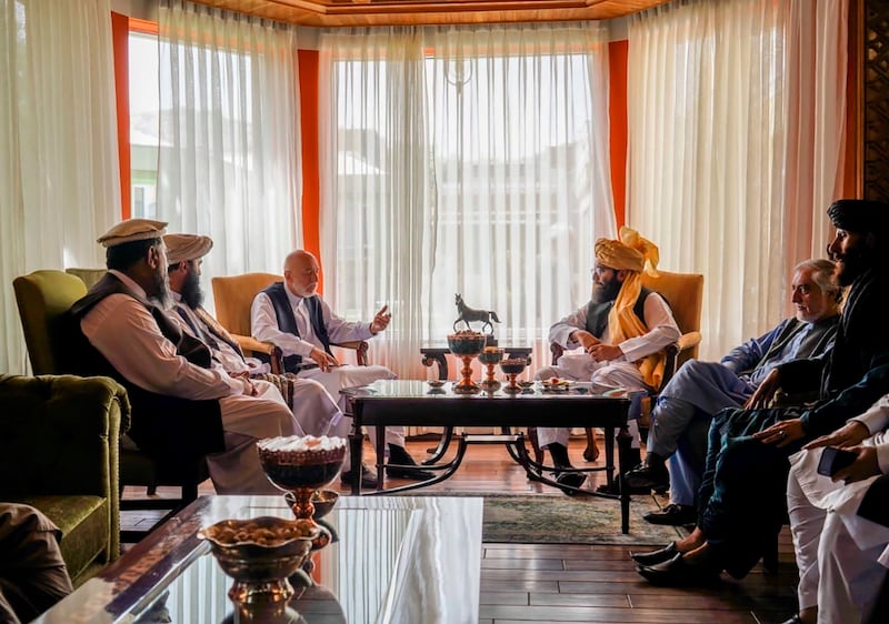 Taliban leaders meet with former President Hamid Karzai in Kabul after a Taliban takeover of the city.