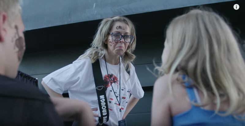 Phelba, Lindsey Stirling's alter ego, talks to a group of children at a VIP experience to meet Stirling.