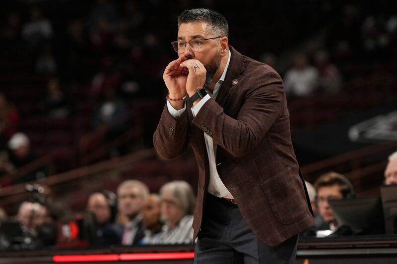 Utah head coach Gavin Petersen shouts to a player during the first half against Indiana in the first round of the NCAA college basketball tournament, Friday, March 21, 2025, in Columbia, S.C. (AP Photo/David Yeazell)