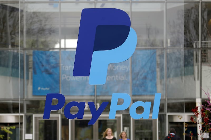 This March 10, 2015, file photo, shows signage outside PayPal headquarters in San Jose, Calif.