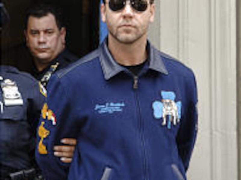 Russell Crowe is taken from police precinct in Manhattan in handcuffs.