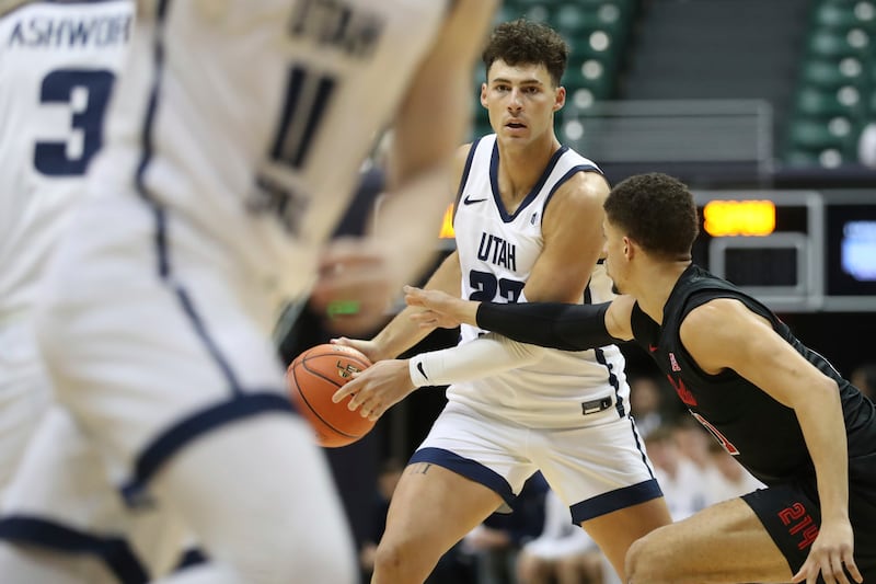 Utah State forward Taylor Funk looks to pass