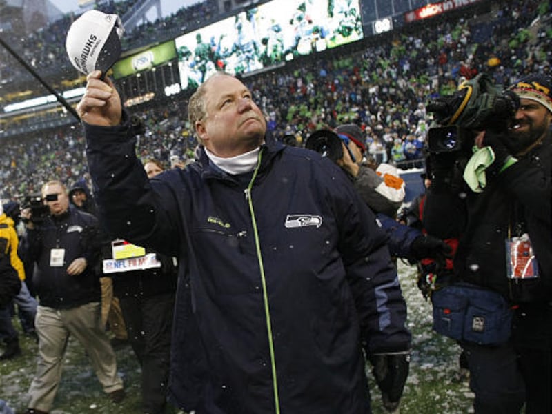 Seattle Seahawks head coach Mike Holmgren waves to fans after Seattle's 13-3 win over the New York Jets in an NFL football game Sunday in Seattle. It was Holmgren's last home game as coach of the team.