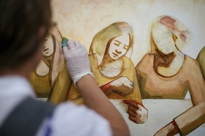 Caitlin Connolly works at her home art studio in Provo on Thursday, April 12, 2018.