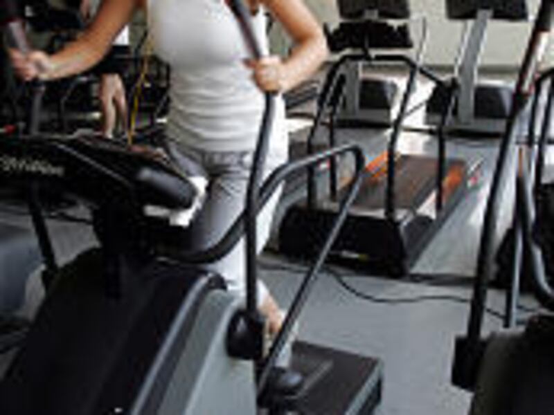 Lisa LaMariana, a student at the University of Albany from Sayville, N.Y., works out on an elliptical trainer at the Arizona Fitness Co. in Albany, N.Y., as treadmills sit unused. Elliptical trainers, which provide a low-impact workout, are making the fas