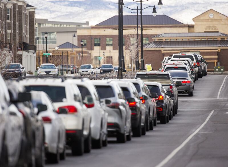 Long lines of cars line up for COVID-19 testing.