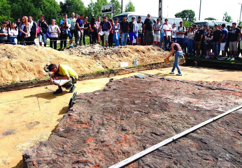 Young people from the Dror School in Israel at the site of the former German Nazi death camp of Sobibor, in eastern Poland, on Tuesday, Aug. 21, 2012. Dror school is trying to find remains of the camp still hidden in the ground in order to redraw its shap