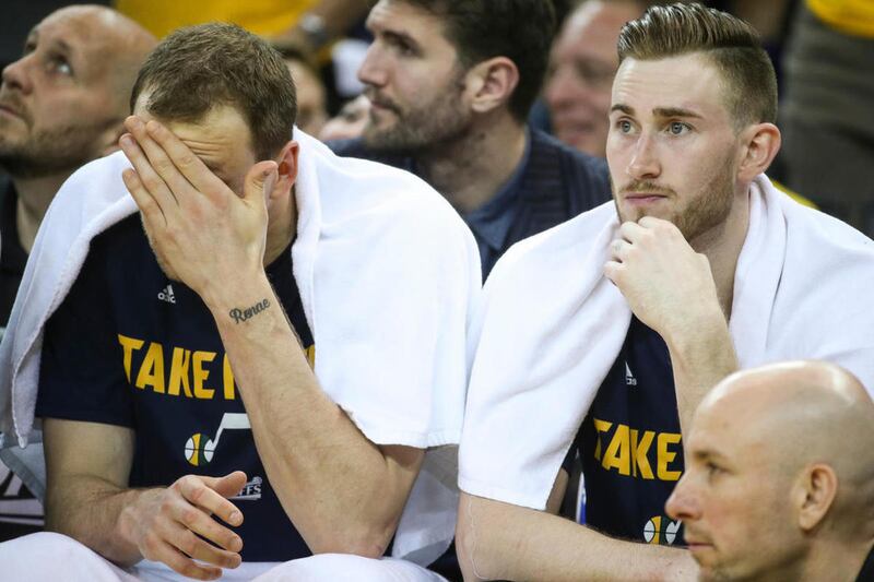 Utah Jazz forward Joe Ingles (2) and forward Gordon Hayward (20) watch from the bench as they trail the Golden State Warriors in the final moments of game one of the NBA Playoffs Western Conference Semifinals at the Oracle Arena in Oakland, Calif., on Tue
