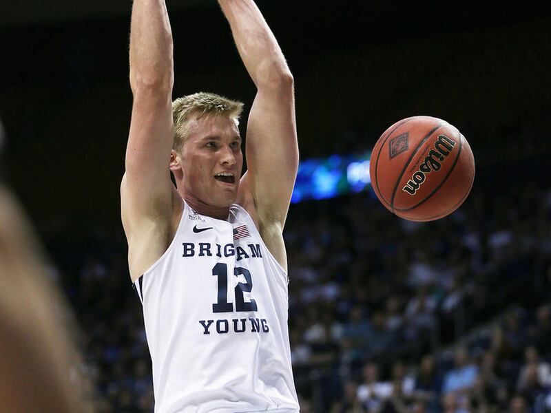 Brigham Young Cougars forward Eric Mika (12) dunks the Ball as BYU and University of Texas at Arlington play in NIT basketball action at the Marriott Center in Provo Utah on Wednesday, March 15, 2017.