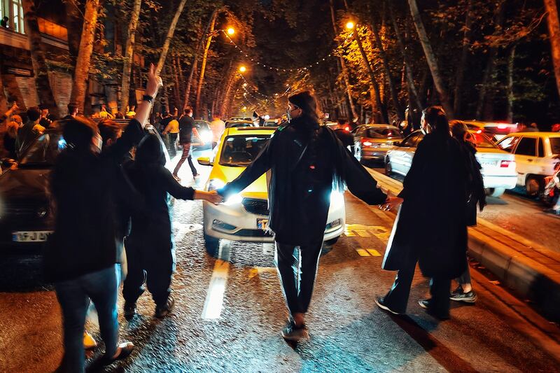 Women protest the death of 22-year-old woman Mahsa Amini in Tehran.
