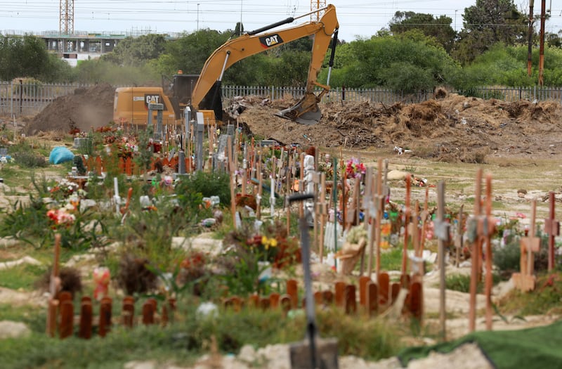 Land is excavated to make way for more burial space in the Maitland cemetery in Cape Town, South Africa, Tuesday, Jan. 19, 2021. The South Africa COVID-19 variant — which is highly transmissible — is in the United States.