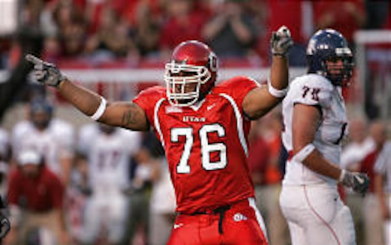 Utah’s Paul Soliai celebrates after sacking Arizona quarterback Adam Austin.
