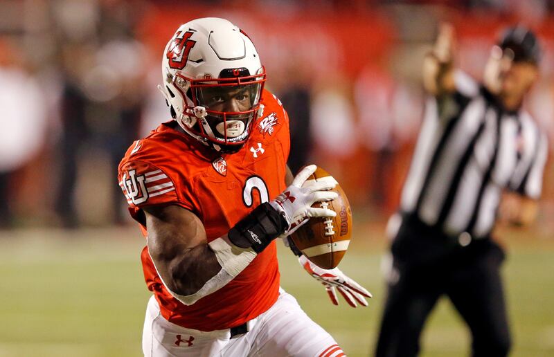 FILE - In this Oct. 20, 2018, file photo, Utah running back Zack Moss (2) carries the ball in the second half during an NCAA college football game against Southern California in Salt Lake City.