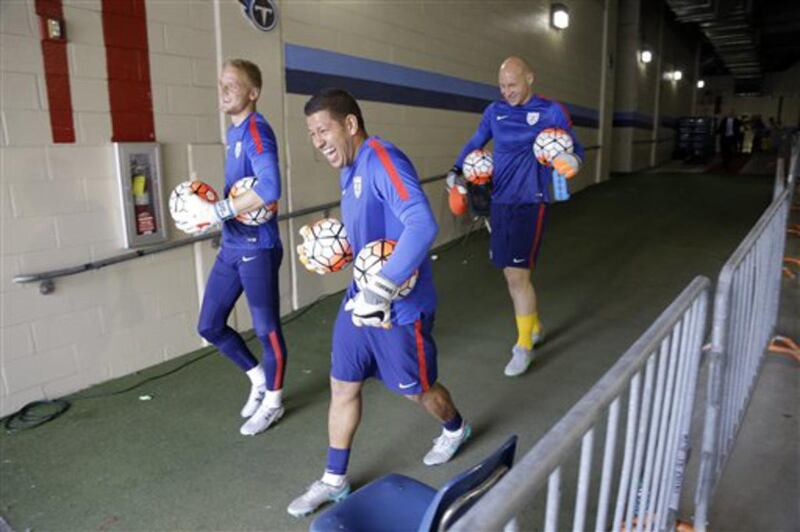 United States goalkeepers William Yarbrough, left; Nick Rimando, center; and Brad Guzan, right; walk to the pitch to warm up before an international friendly soccer match against the Guatemala Friday, July 3, 2015, in Nashville, Tenn.