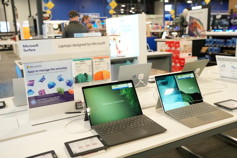 Laptops sit on display in a Best Buy store Nov. 21, 2023, in southeast Denver.