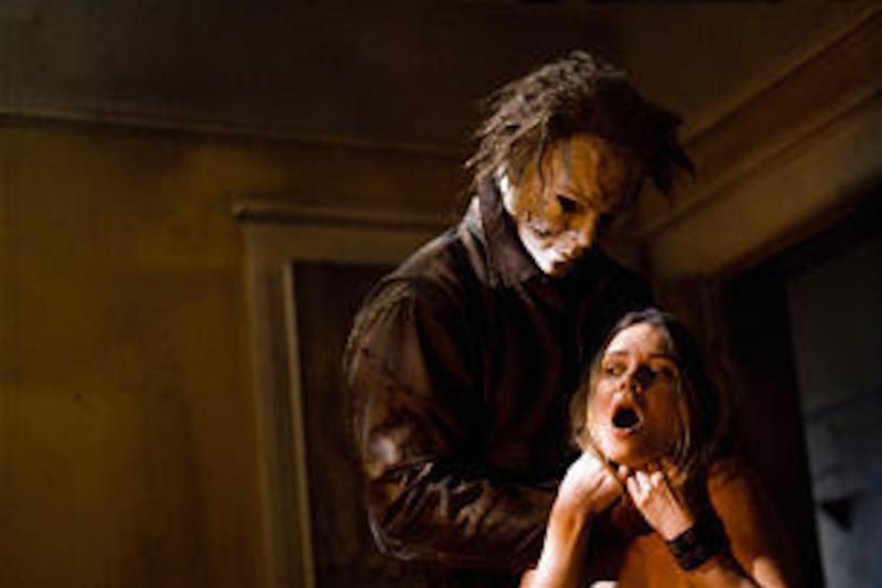 Tyler Mane, as Michael Myers, and Kristina Klebe, as Lynda, star<BR> in Rob Zombie's dismal remake of John Carpenter's "Halloween."