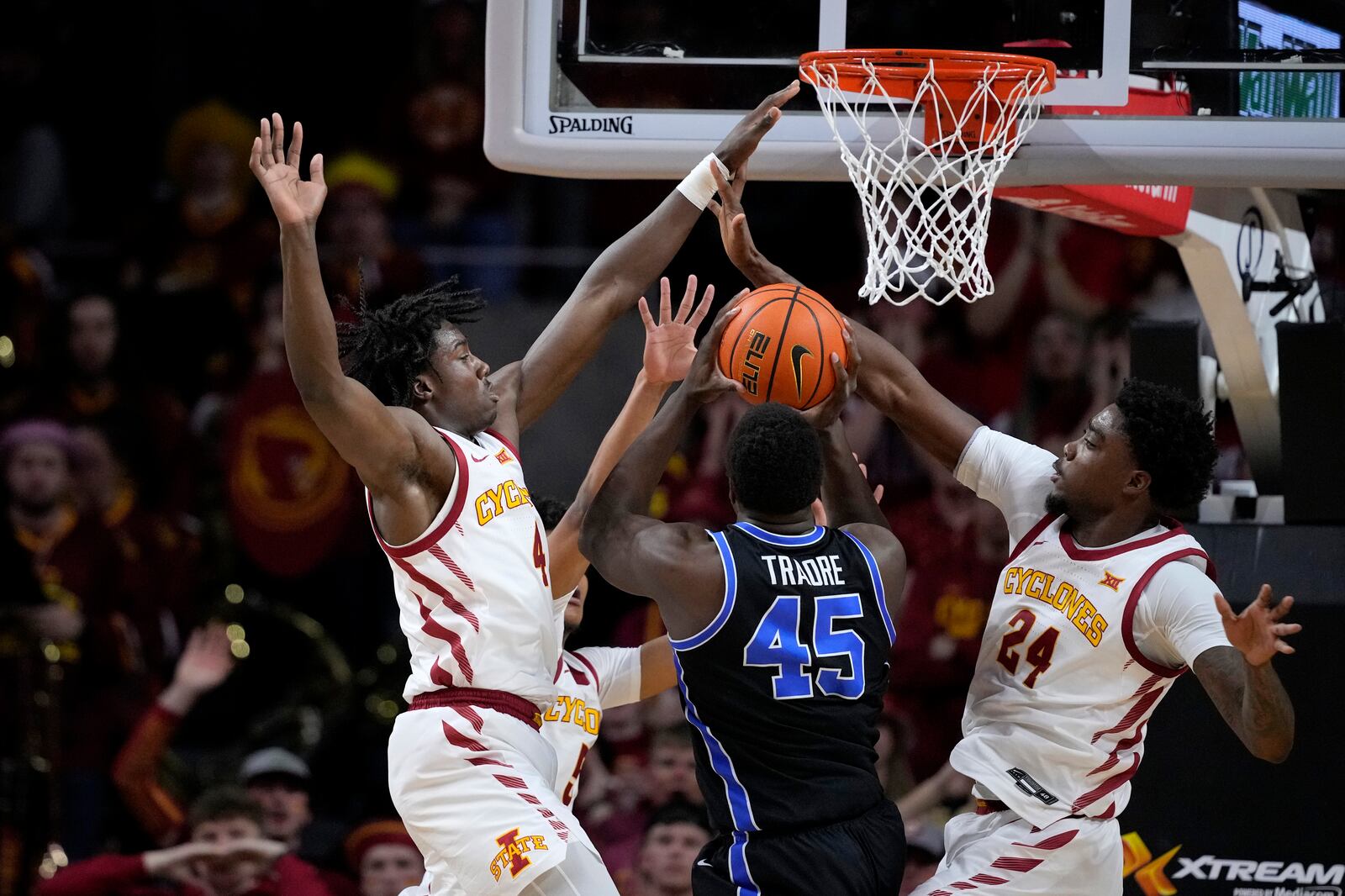 Iowa State guard Demarion Watson (4) and forward Hason Ward (24) stop a shot attempt by BYU forward Fousseyni Traore (45) during game, Wednesday, March 6, 2024, in Ames, Iowa. The two top-25 teams meet again in Ames on Tuesday night, with Big 12 tourney seeding ramifications on the line.